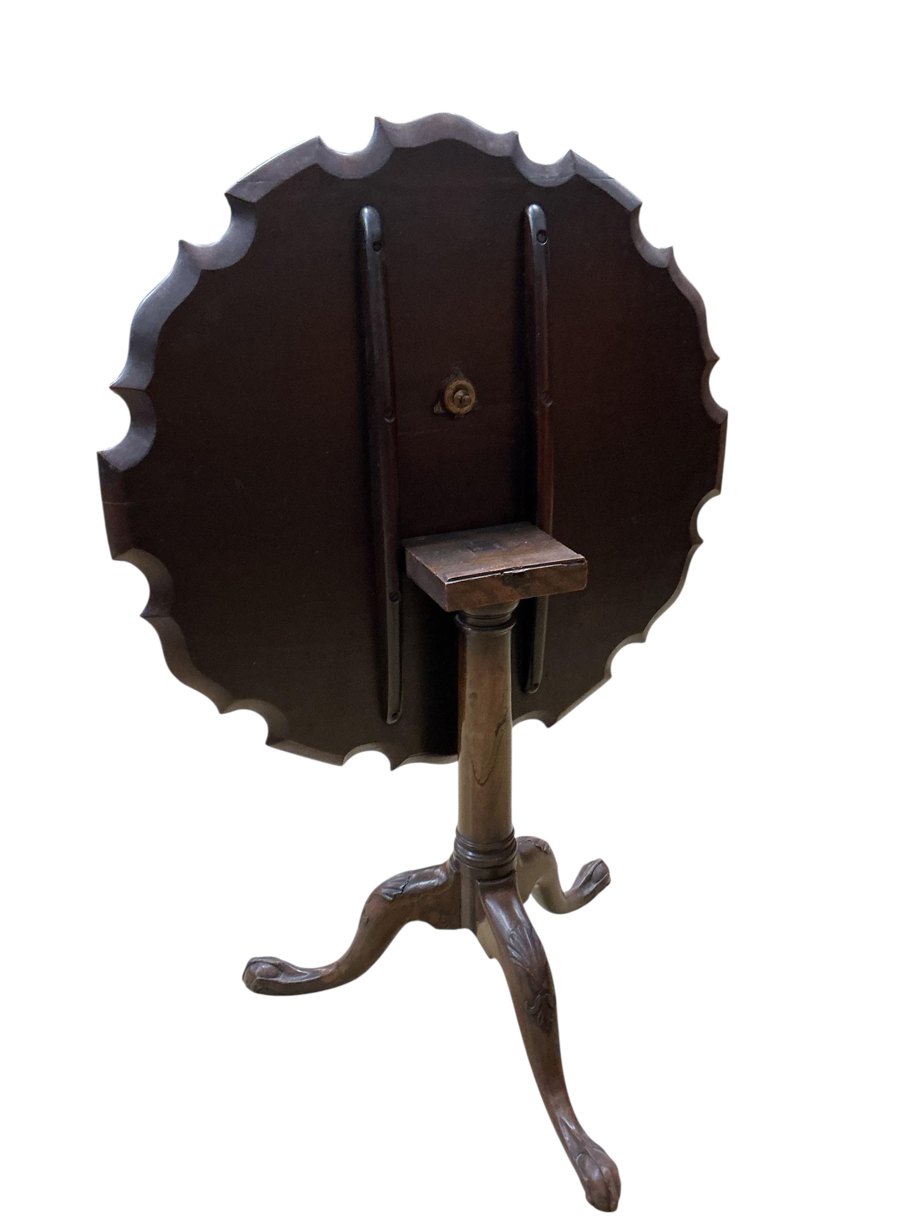 A George III piecrust circular tilt top tripod tea table, diameter 77cm, height 68cm